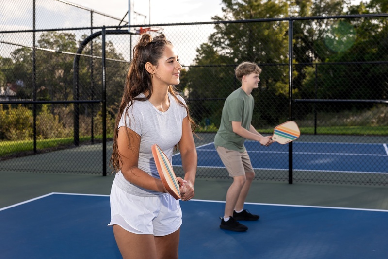 Two guests playing pickleball at Evermore.