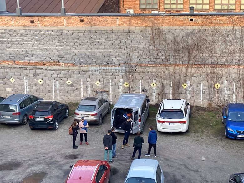 Team gathers at parking lot in Krakow