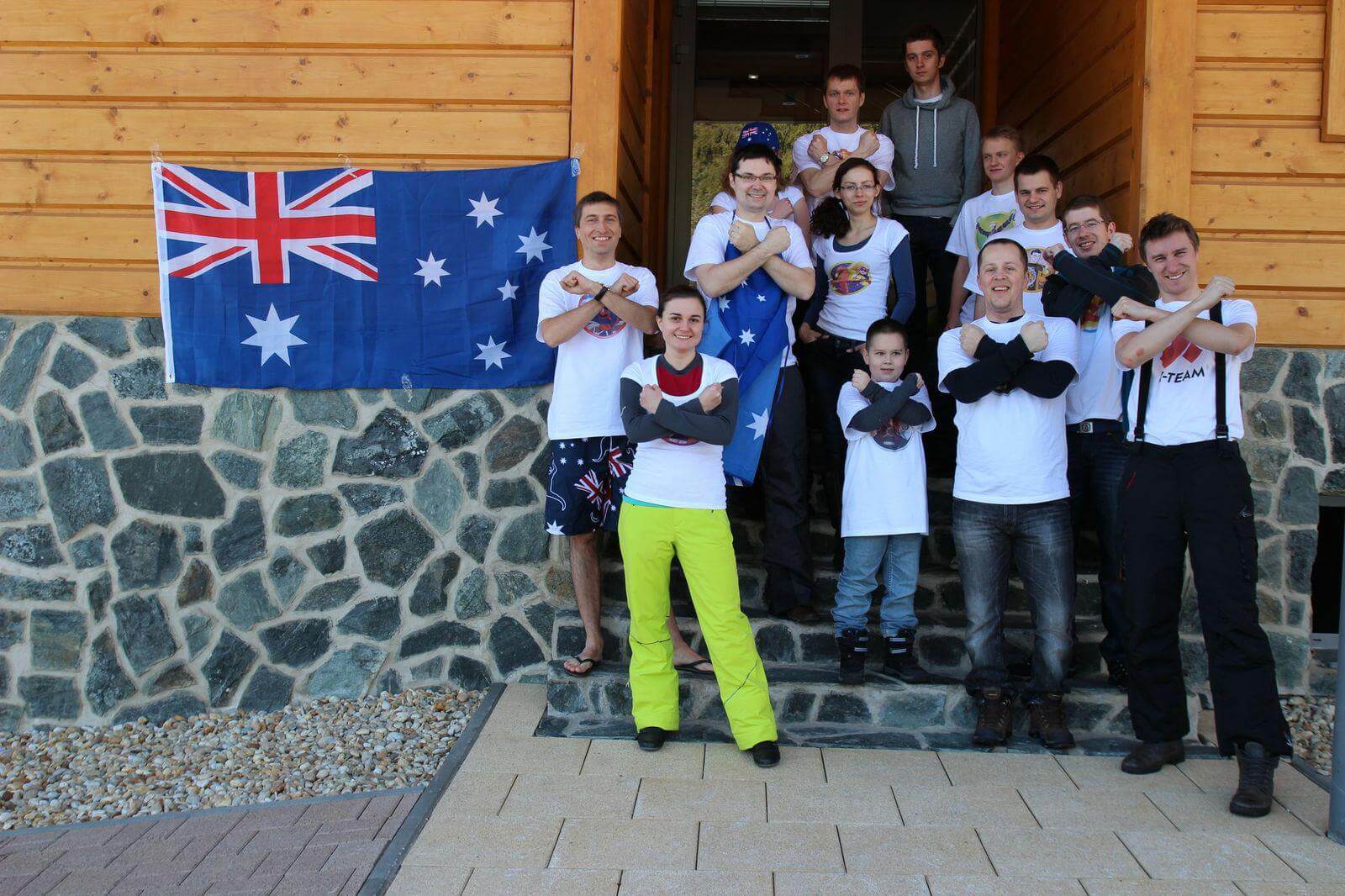xfive team stands on the steps in front of cottage