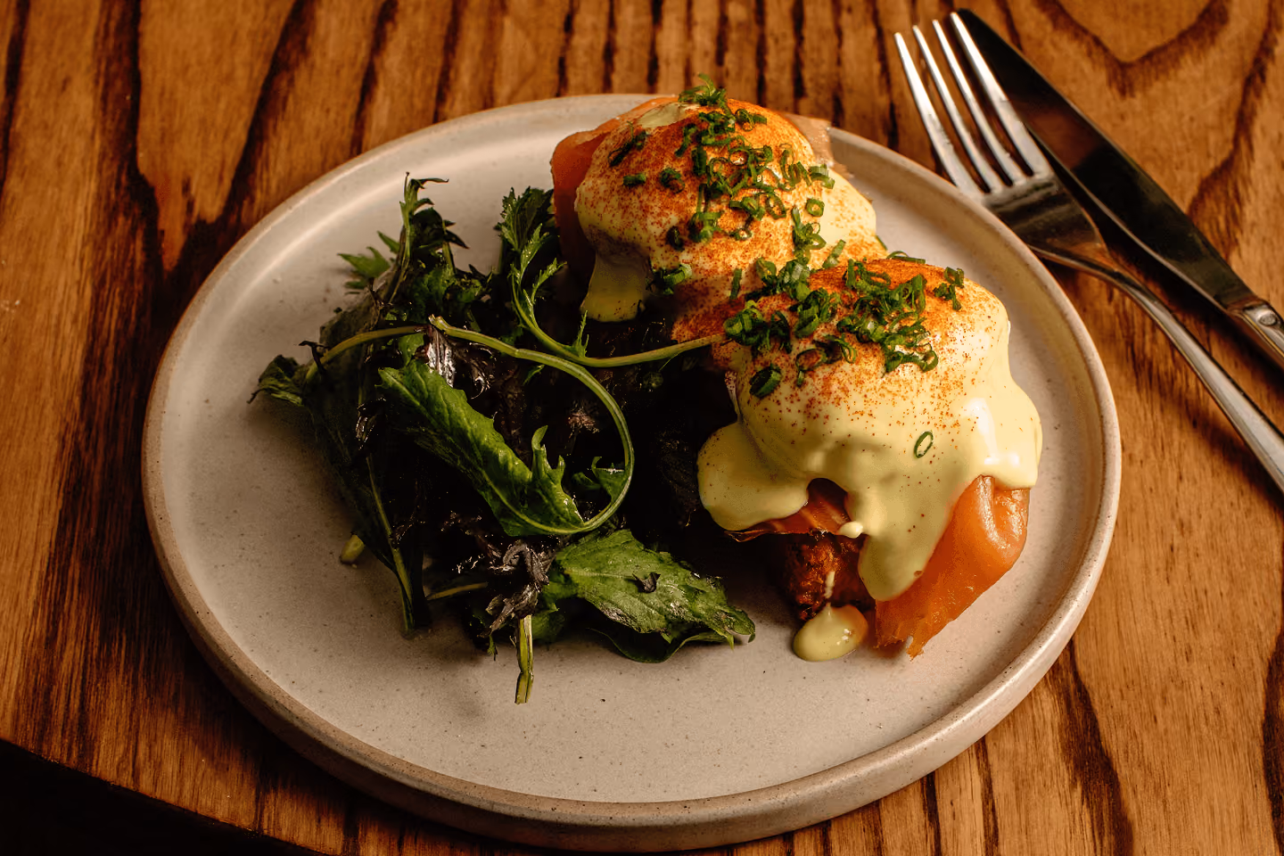 A table set for weekend brunch at Neighbourhood Naas, pancakes and coffee in the morning light.