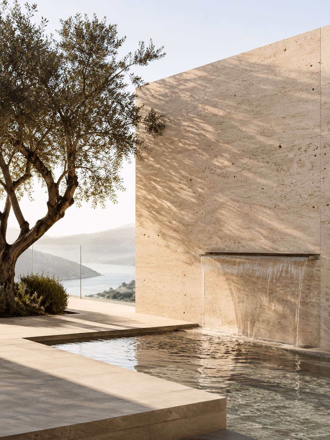 Minimal private wellness interior with natural stone, warm wood and soft daylight