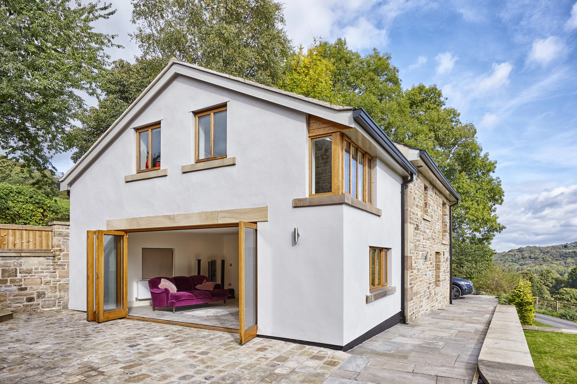 Exterior view of bifold doors opening onto the patio at Fieldings Farm