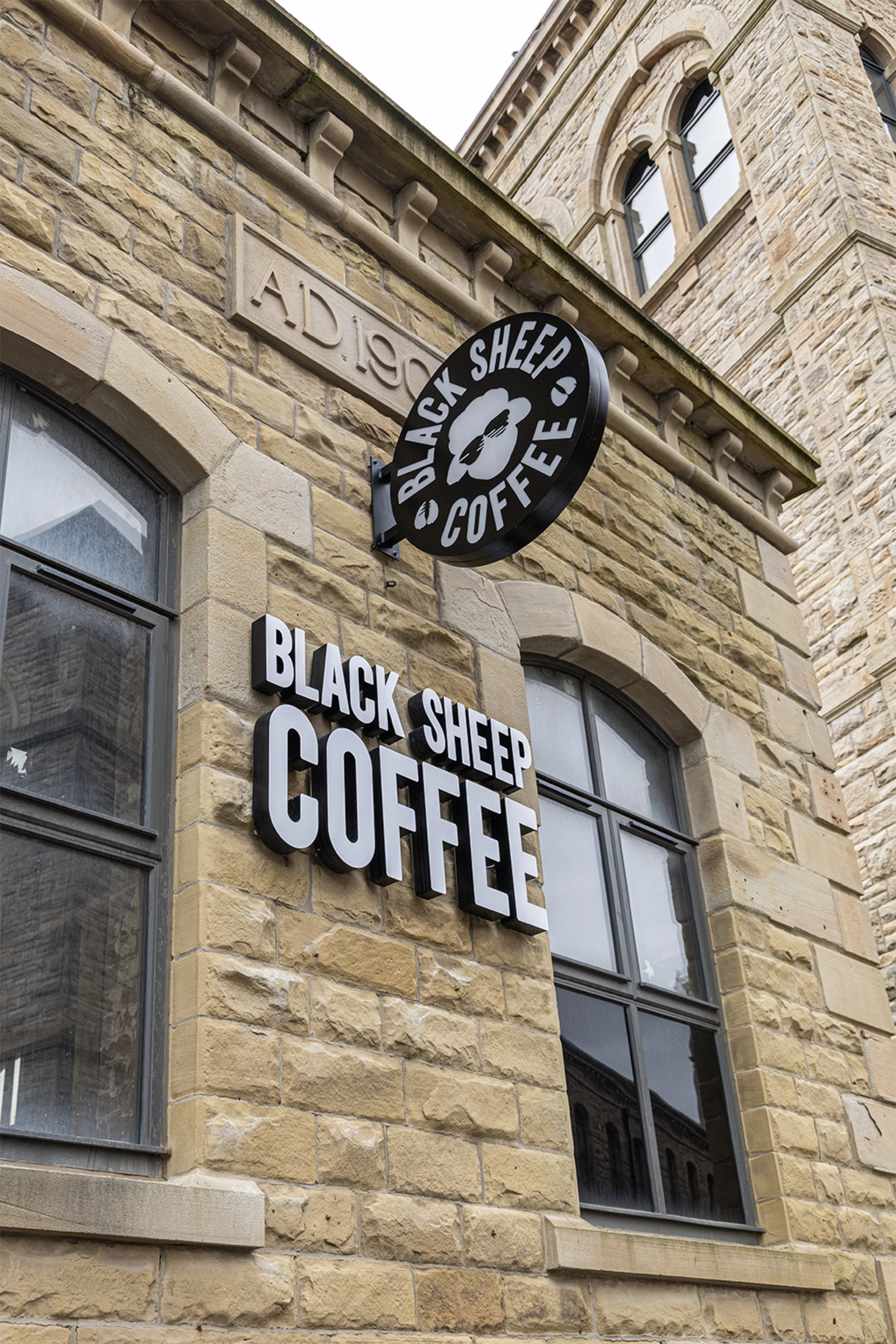 Exterior photograph of the Black Sheep Coffee sign and entrance at Northlight