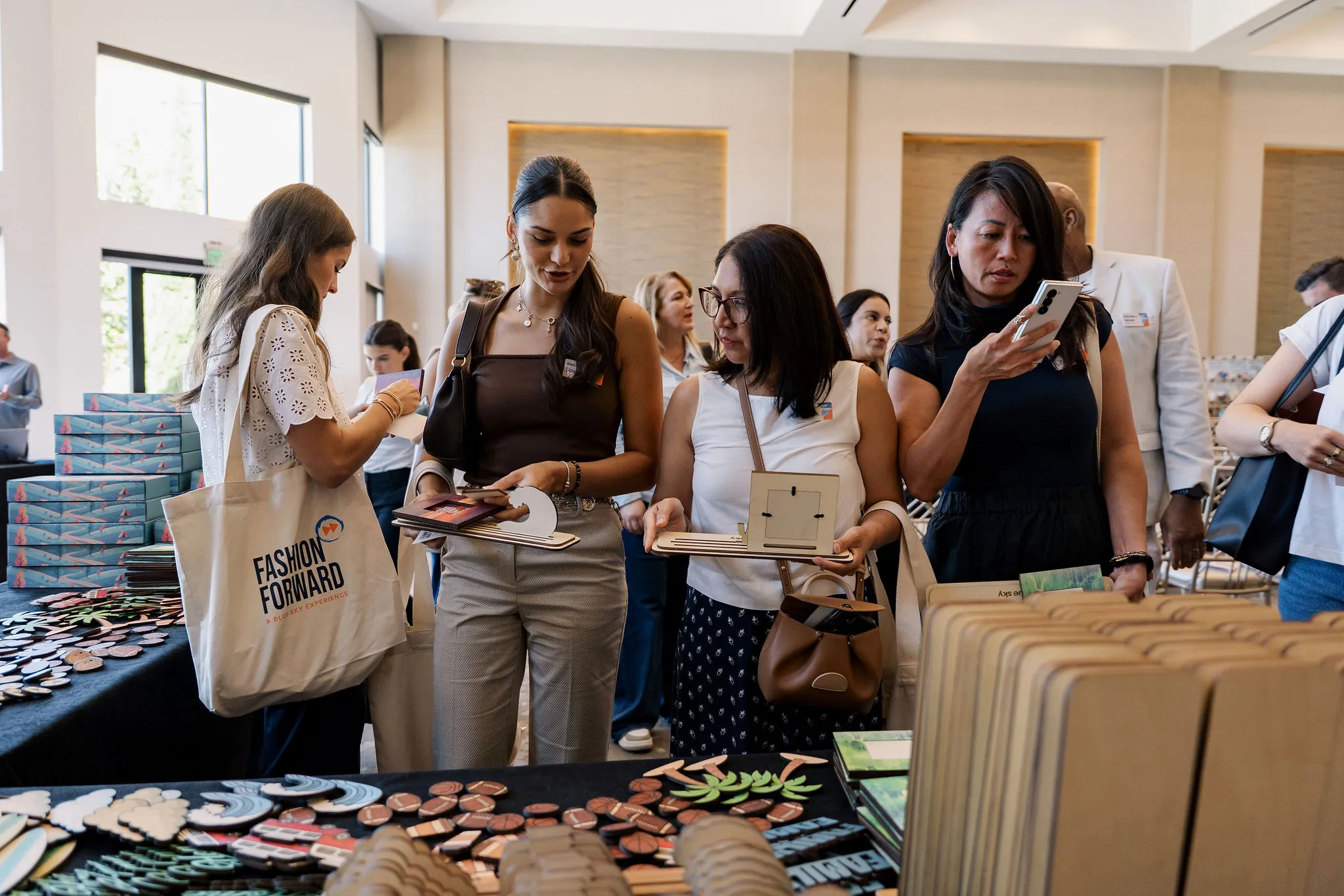 Guests browsing patches and branded products at a Fashion Forward hands-on station