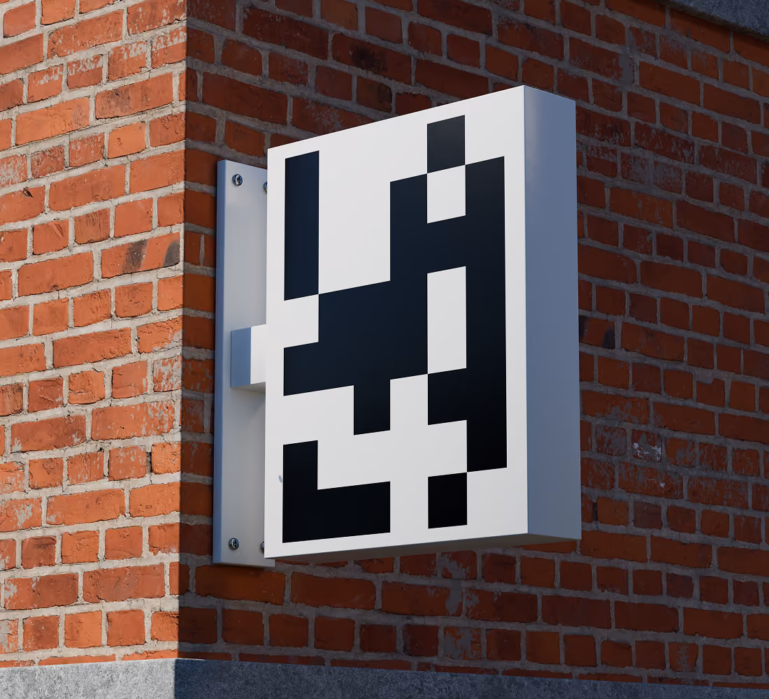 A LazyType Mockup showing a white sign with a black pixelated type saying LAZY mounted on red brick wall.