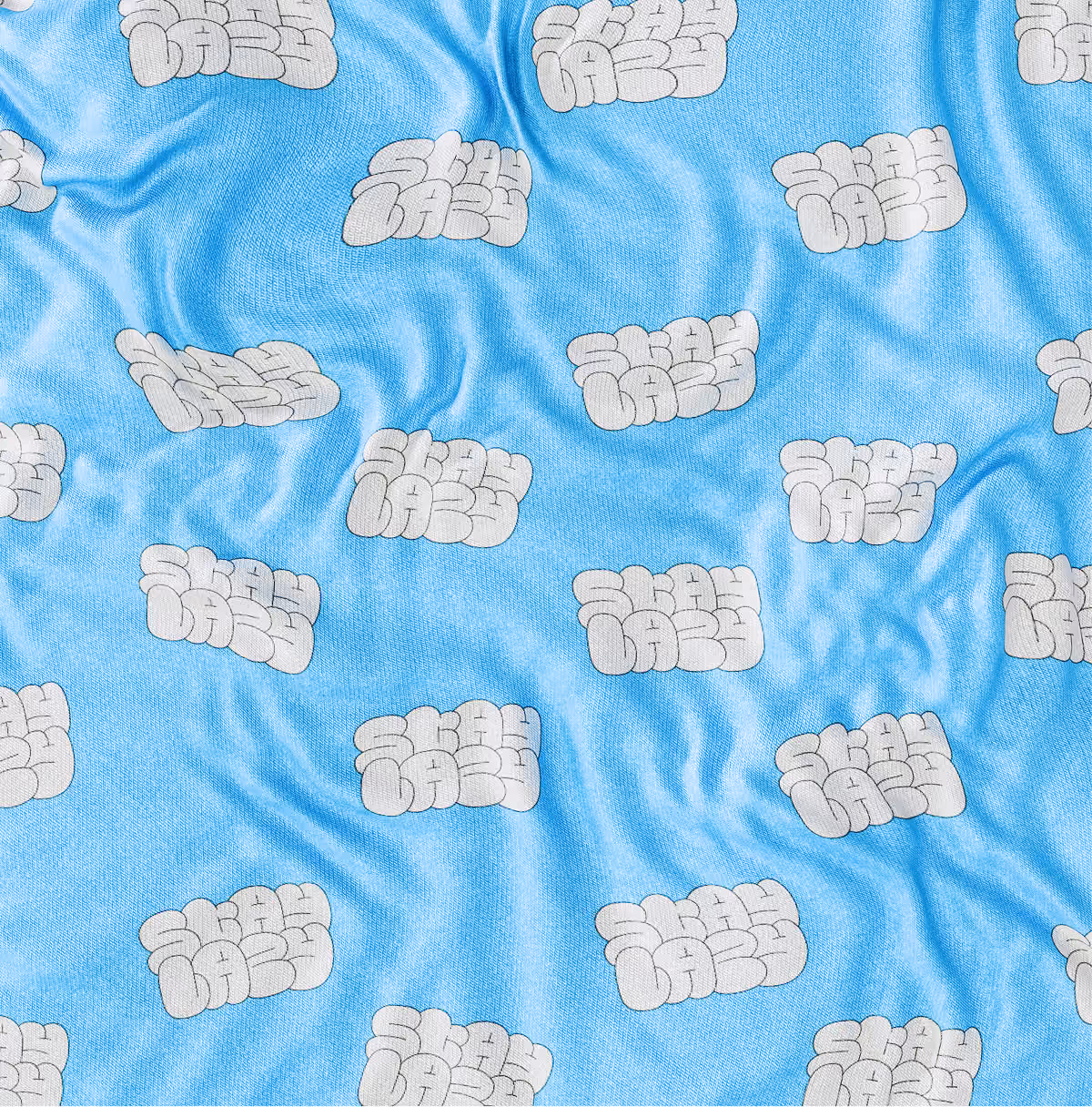 A LazyType Mockup showing a light blue fabric with repeated white bubble-type pattern reading 'Stay Lazy'.