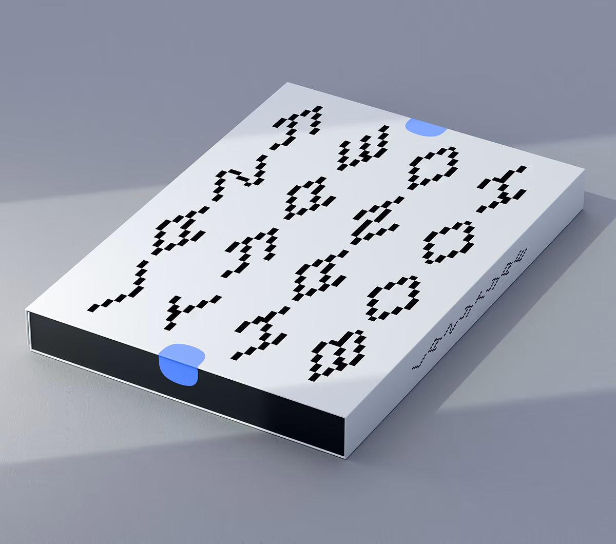 A LazyType Mockup showing a white box with pixelated black text saying 'Lazy Type Hand Book' and two blue stickers on a grey surface.