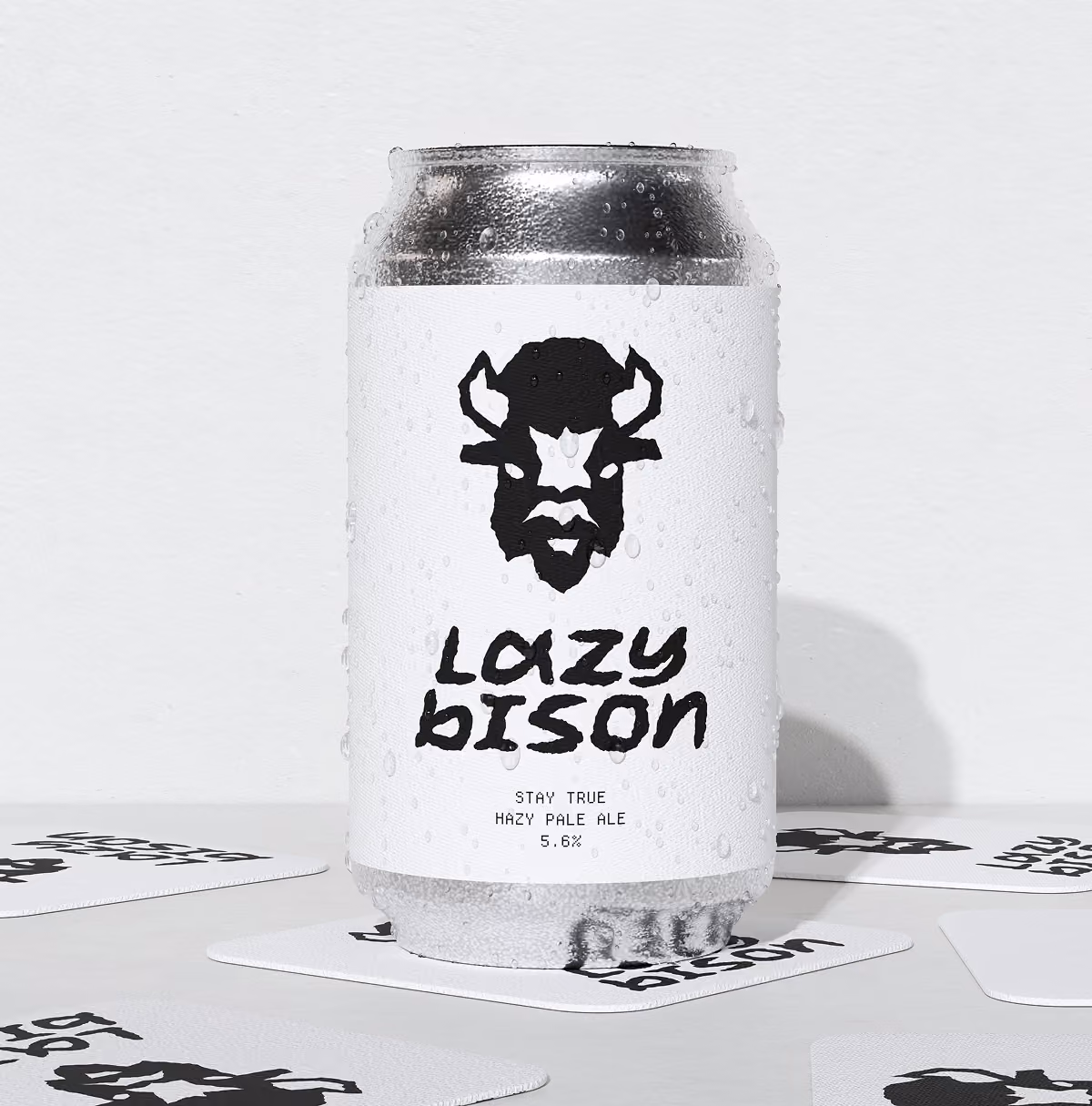 A LazyType Mockup with a condensation-covered can of Lazy Bison hazy pale ale with a bison logo and text on white label.
