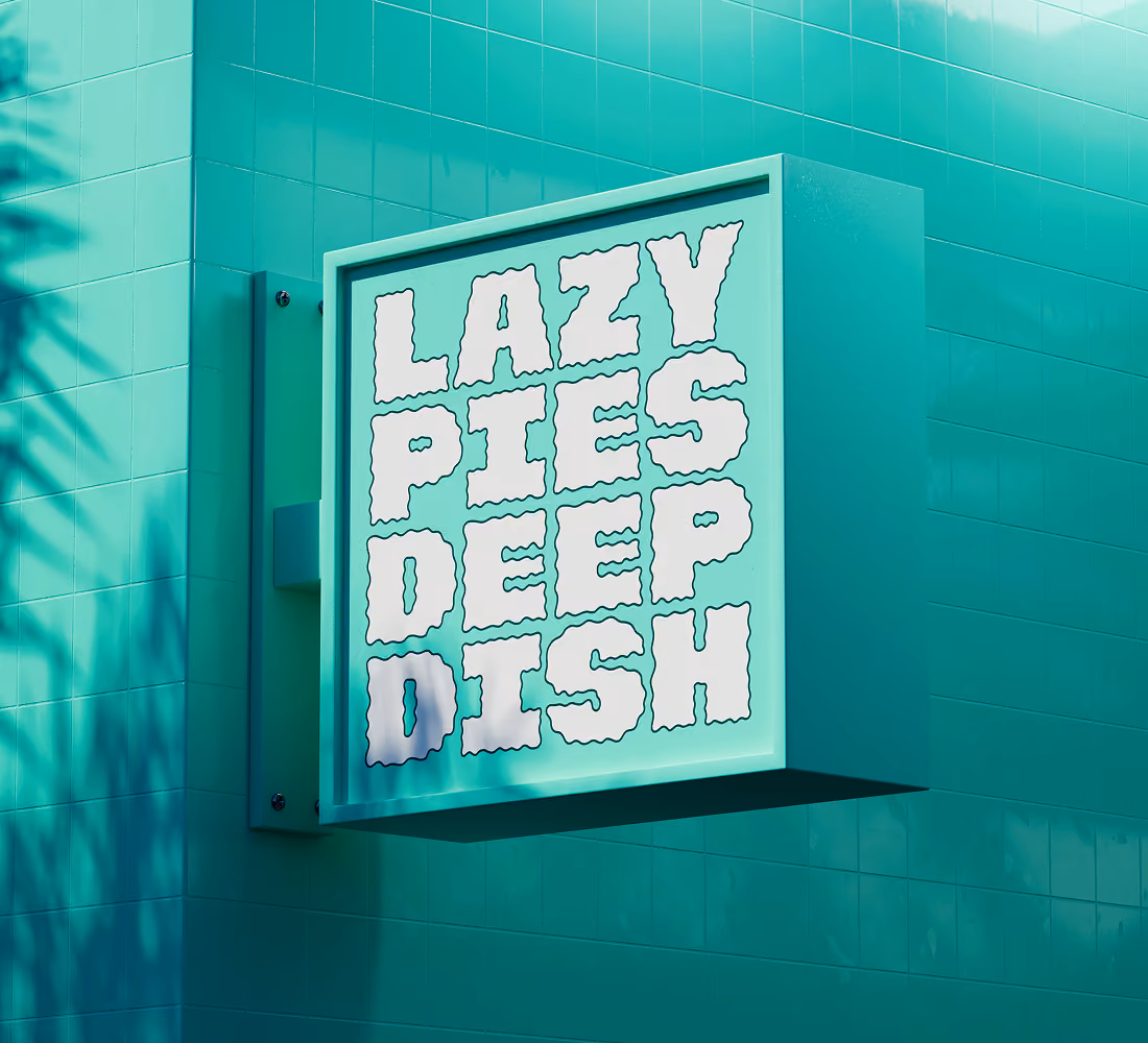 A LazyType Mockup with a turquoise wall with a sign reading LAZY PIES DEEP DISH in white wavy letters.