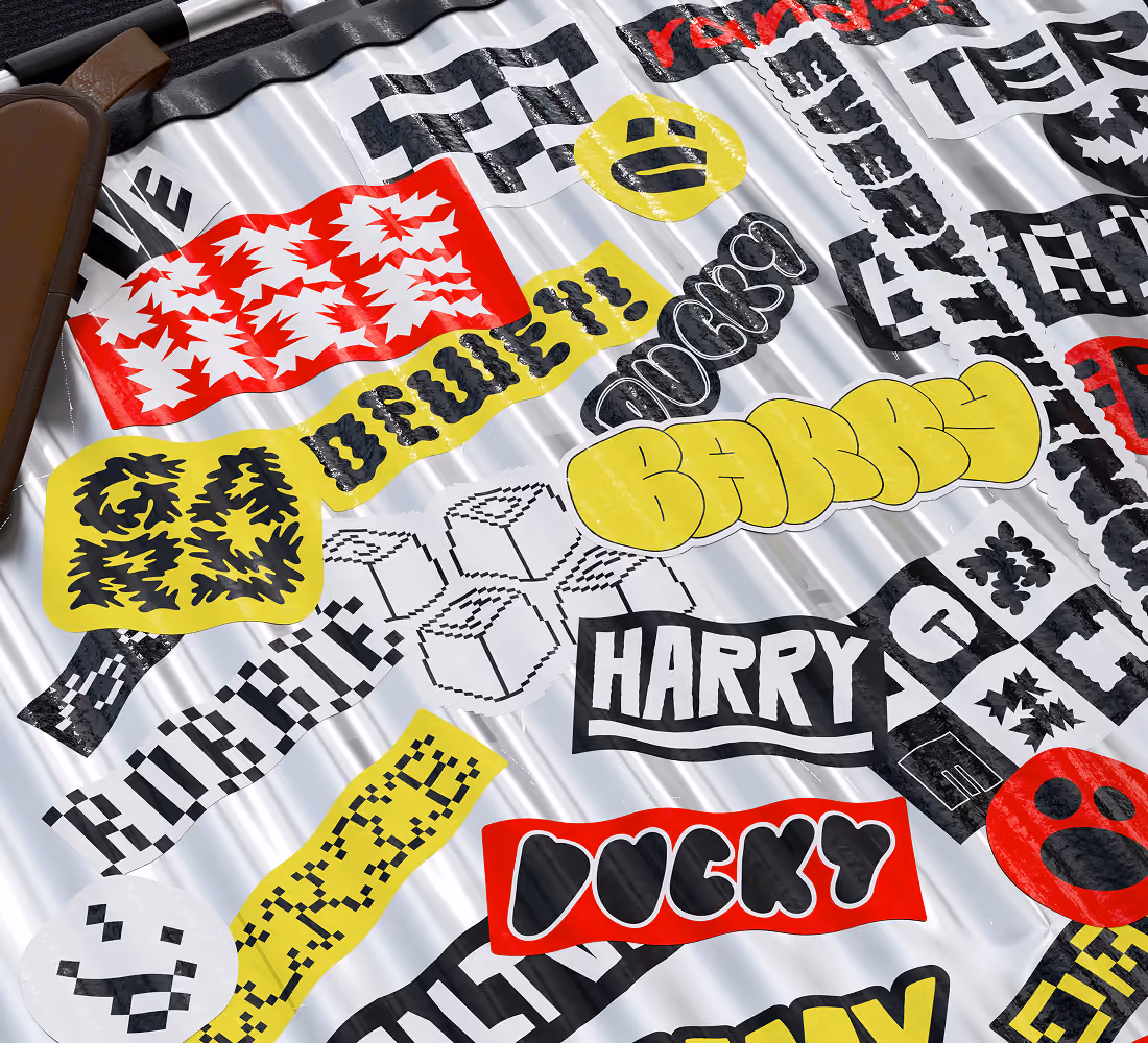 A LazyType mockup showing a metal suitcase covered in LazyType font stickers. 