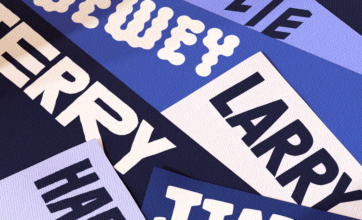 A LazyType mockup showing a close-up of different bold fonts on various cards with different shades of blue.