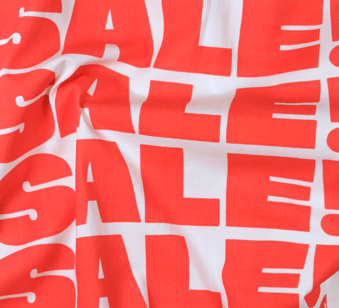 LazyType Merch showing red stacked text reading "SALE! SALE! SALE! SALE!" on white cotton t-shirt.