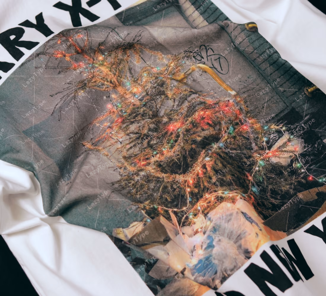 LazyType merch showing a detailed view of the t-shirt print showing an illuminated Christmas tree graphic with some type.