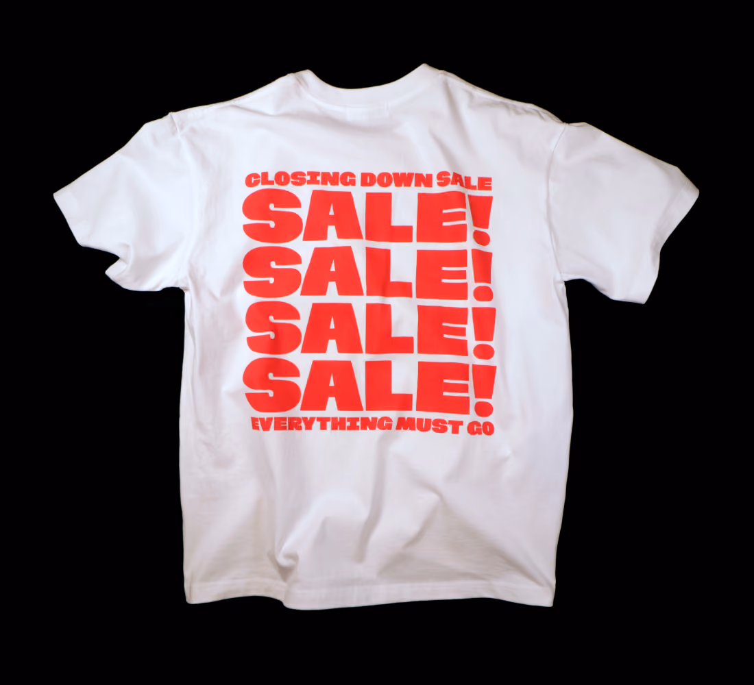 LazyType merch showing a bold red stacked typography design reading "SALE! SALE! SALE! SALE!" on white cotton fabric.