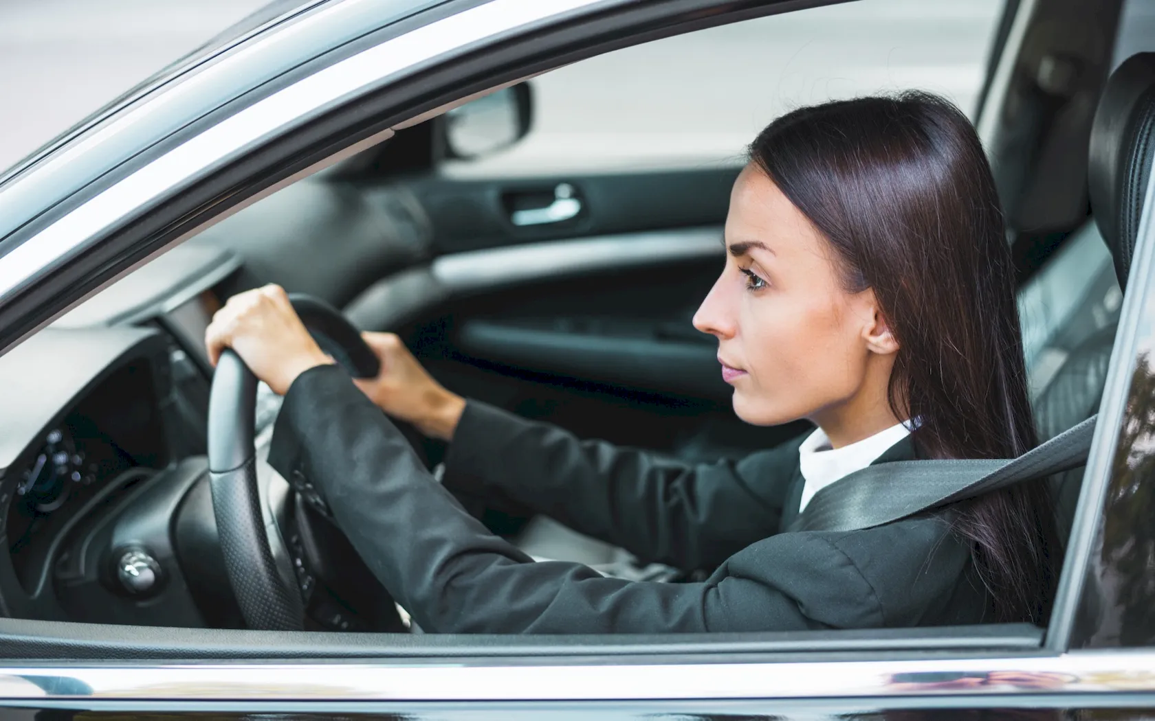Businesswoman driving her personal car for work