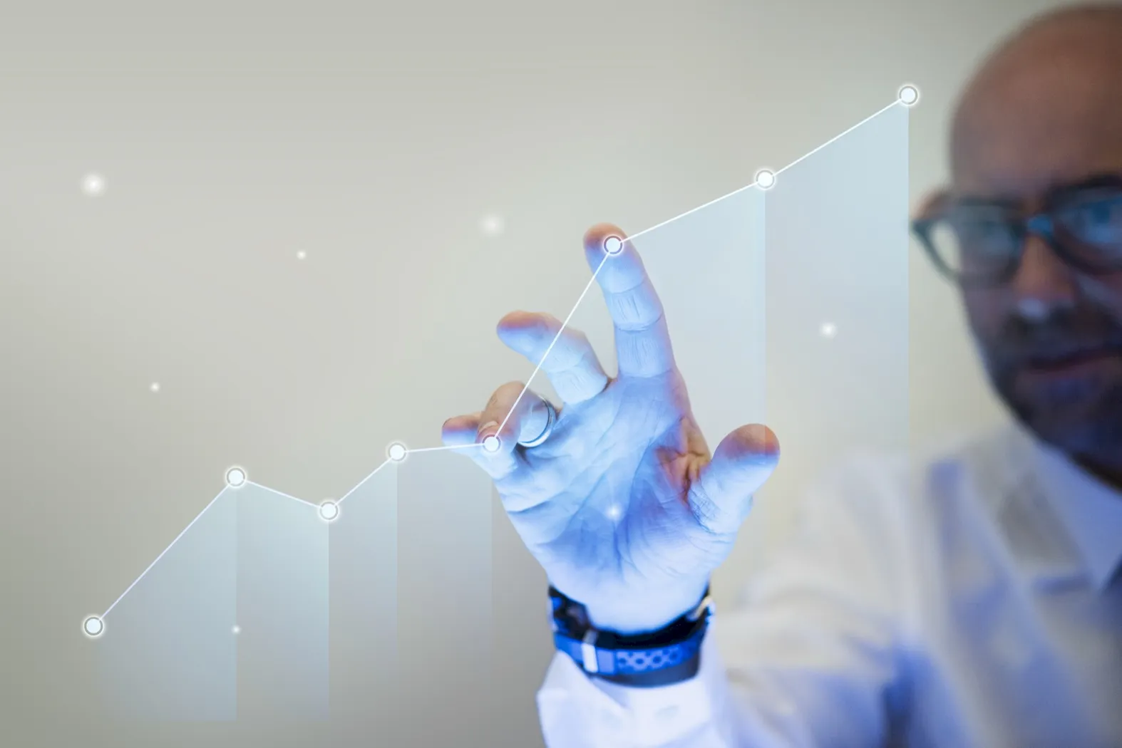 Hands reviewing a financial growth chart
