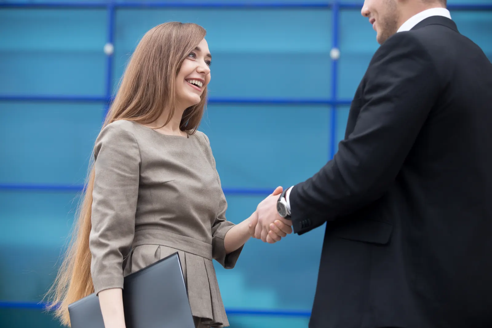 Business partners shaking hands after forming their company