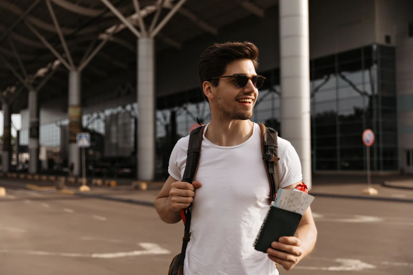 Traveler with passport and suitcase ready for their flight