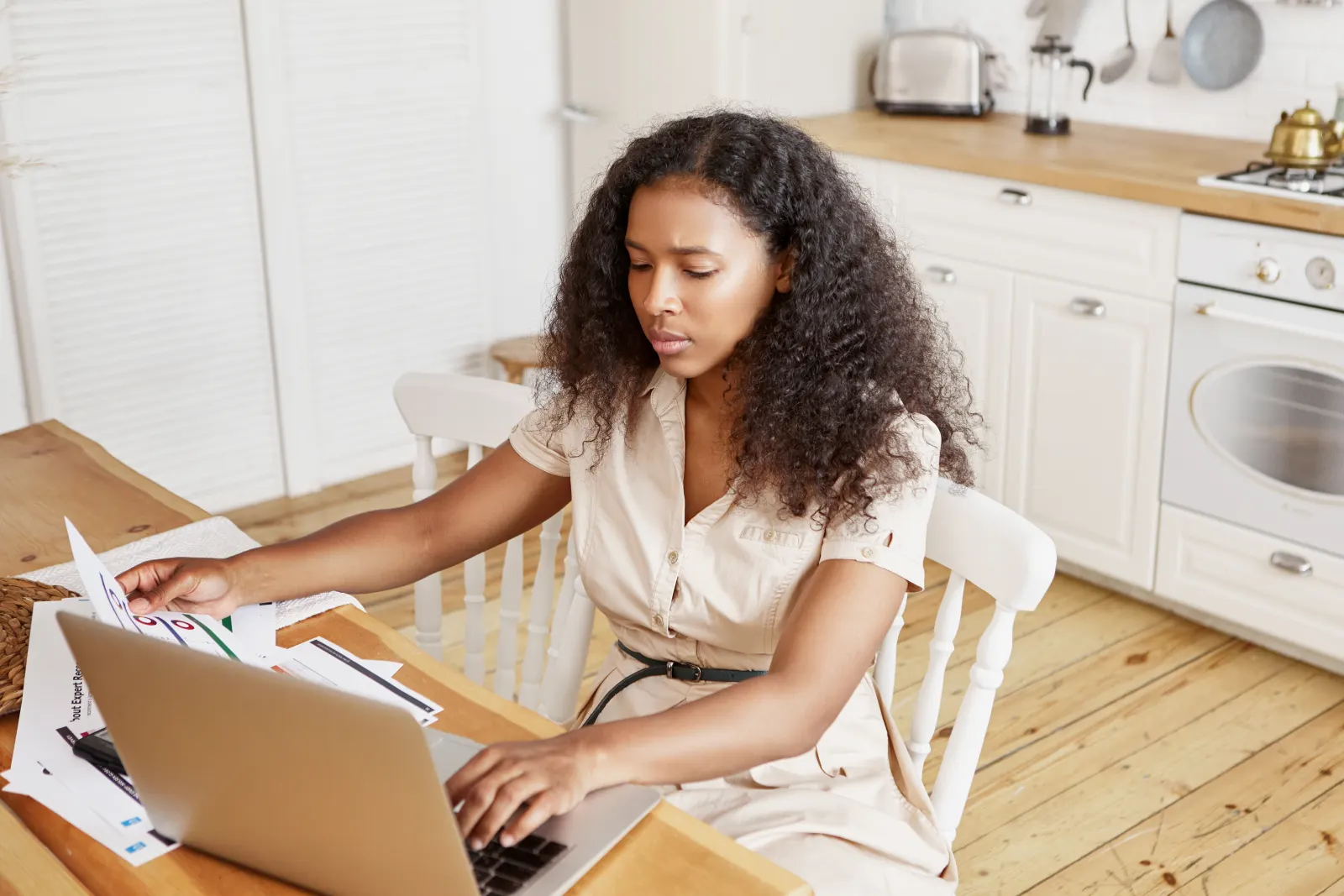 Woman organizing payments and administrative paperwork at home