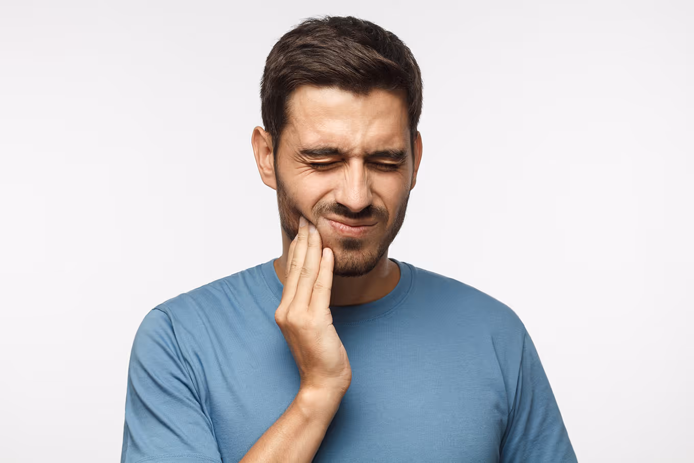 man holding jaw