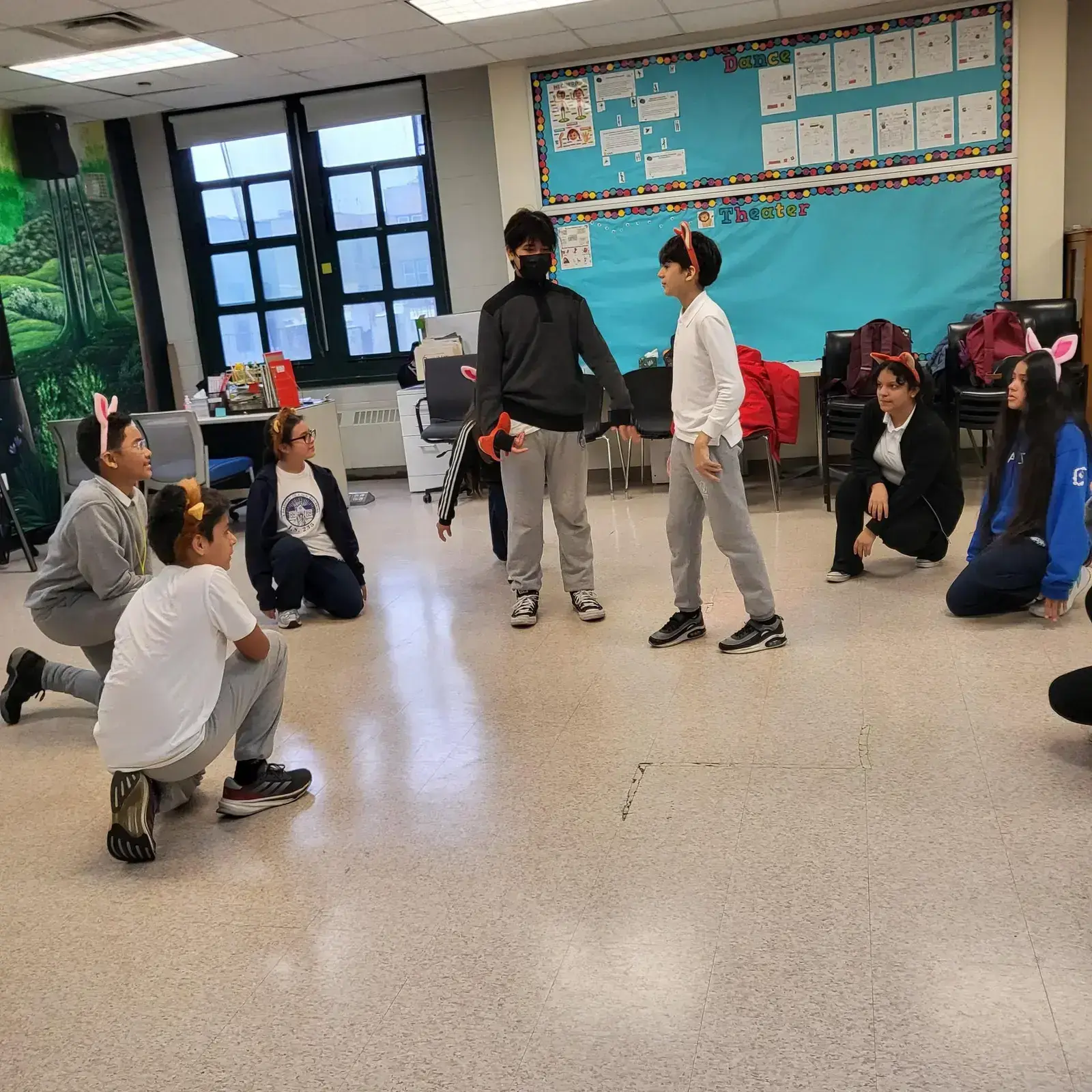 Students rehearsing a theater scene in a dance and theater classroom