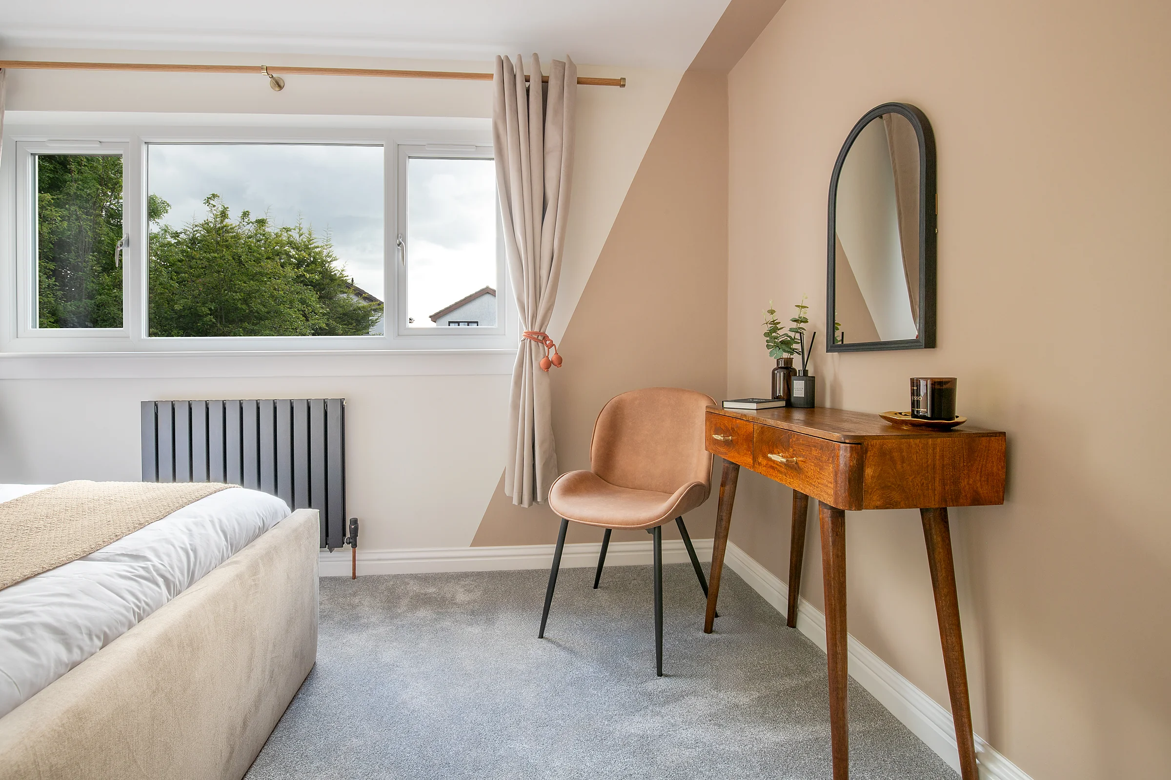 Bedroom with a desk and armchair