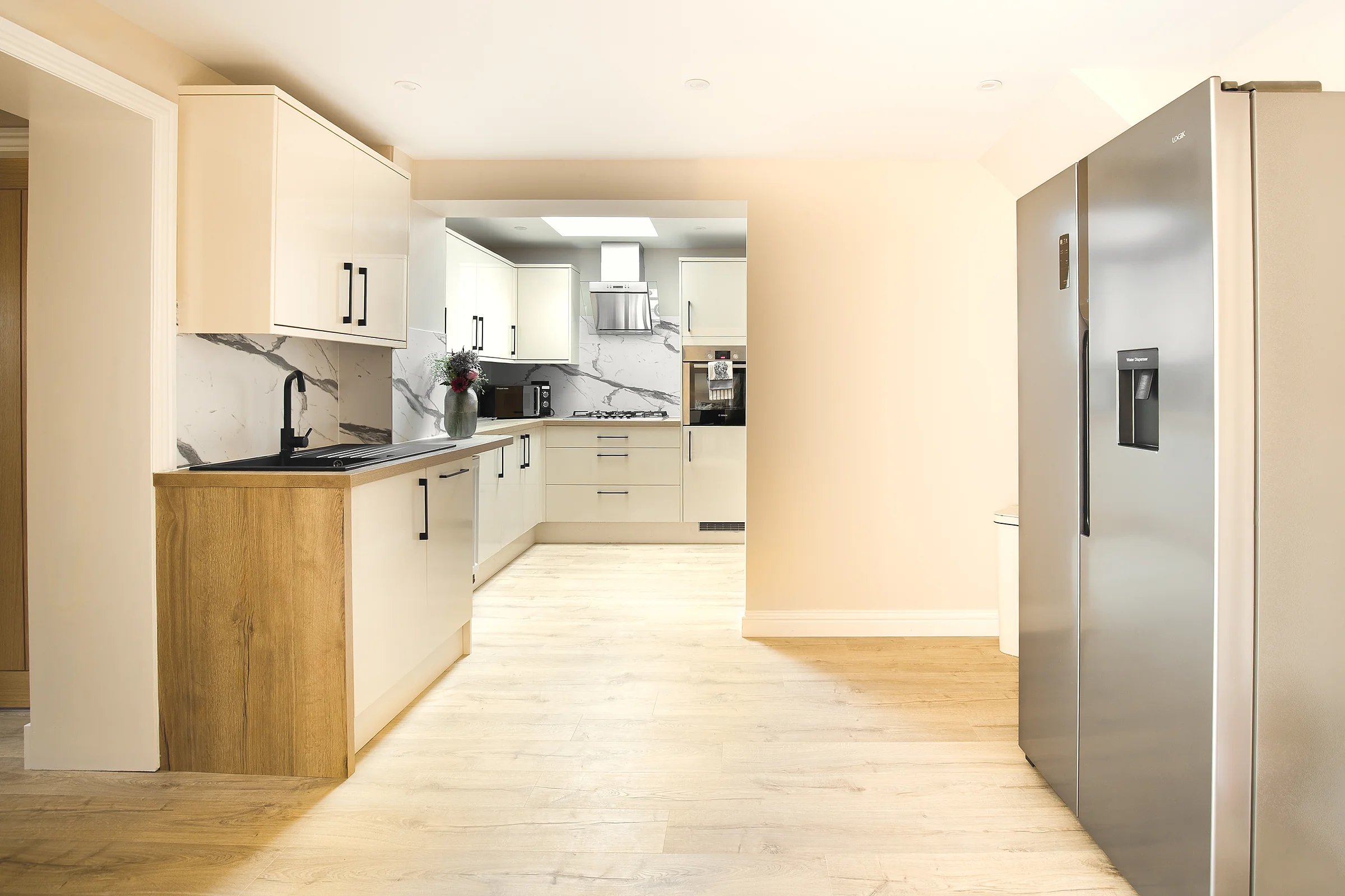 Fully equipped kitchen with large fridge freezer