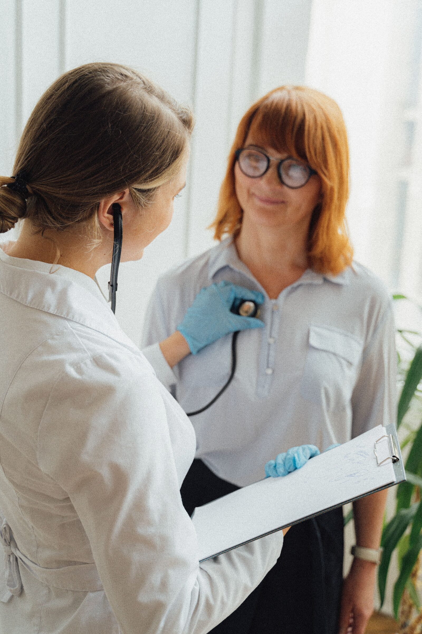 A clinician examining a patient
