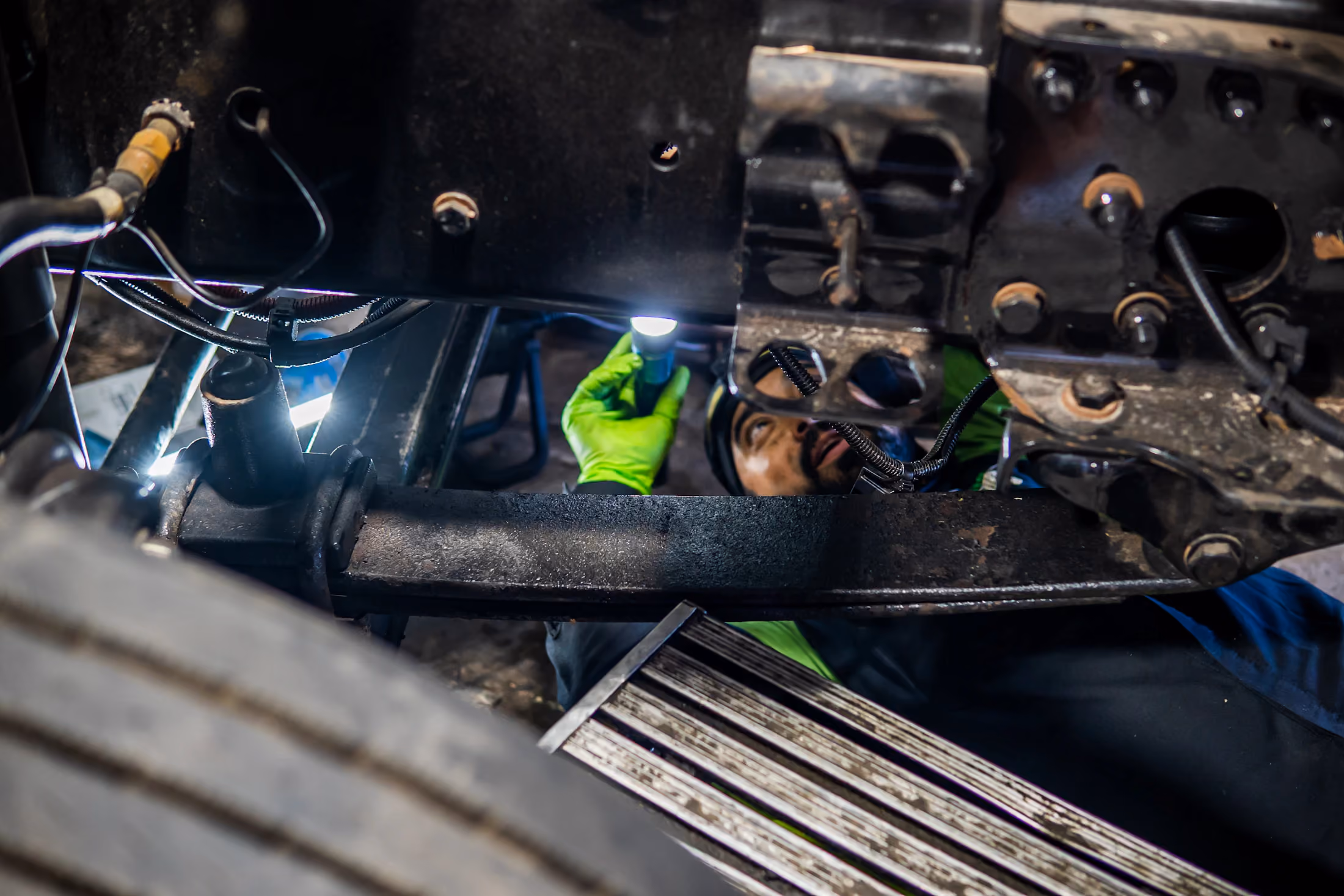 Mechanic performing suspension repair in Alvin, TX
