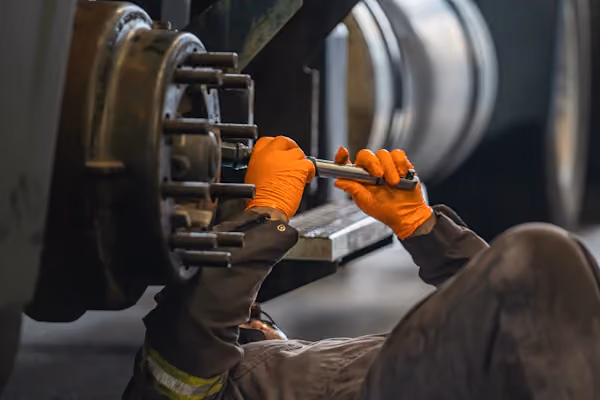 Mechanic performing truck brake repair in Alvin, TX