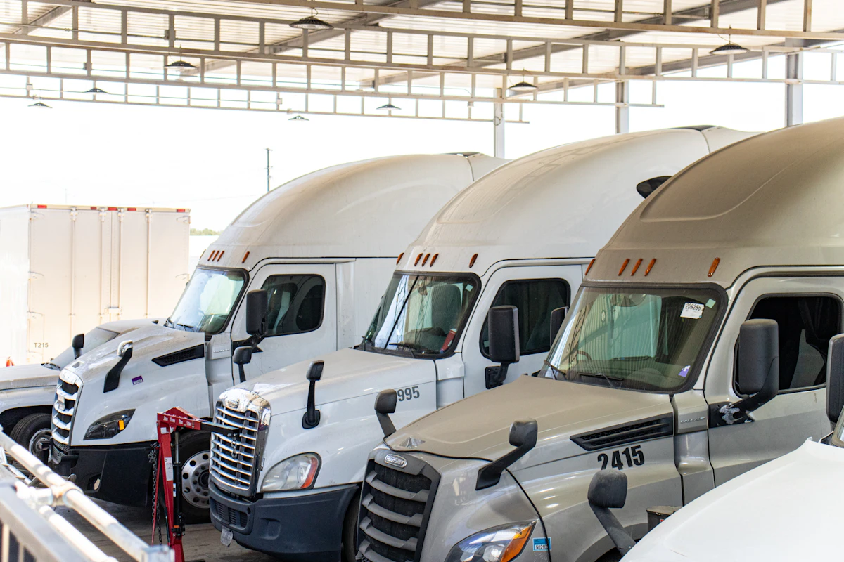 heavy duty fleet trucks in repair bay