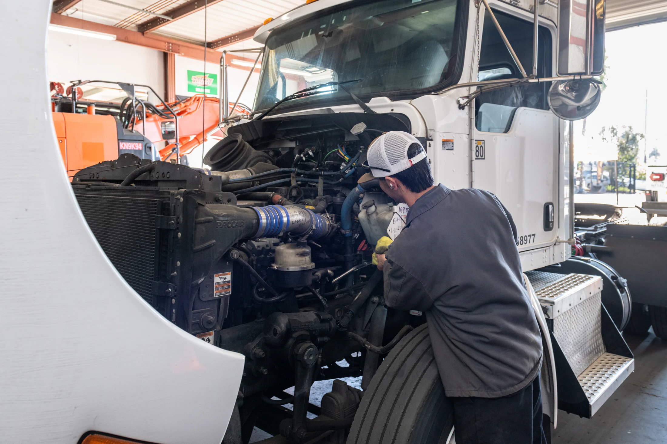 Diesel mechanic performing truck repair in Alvin, TX