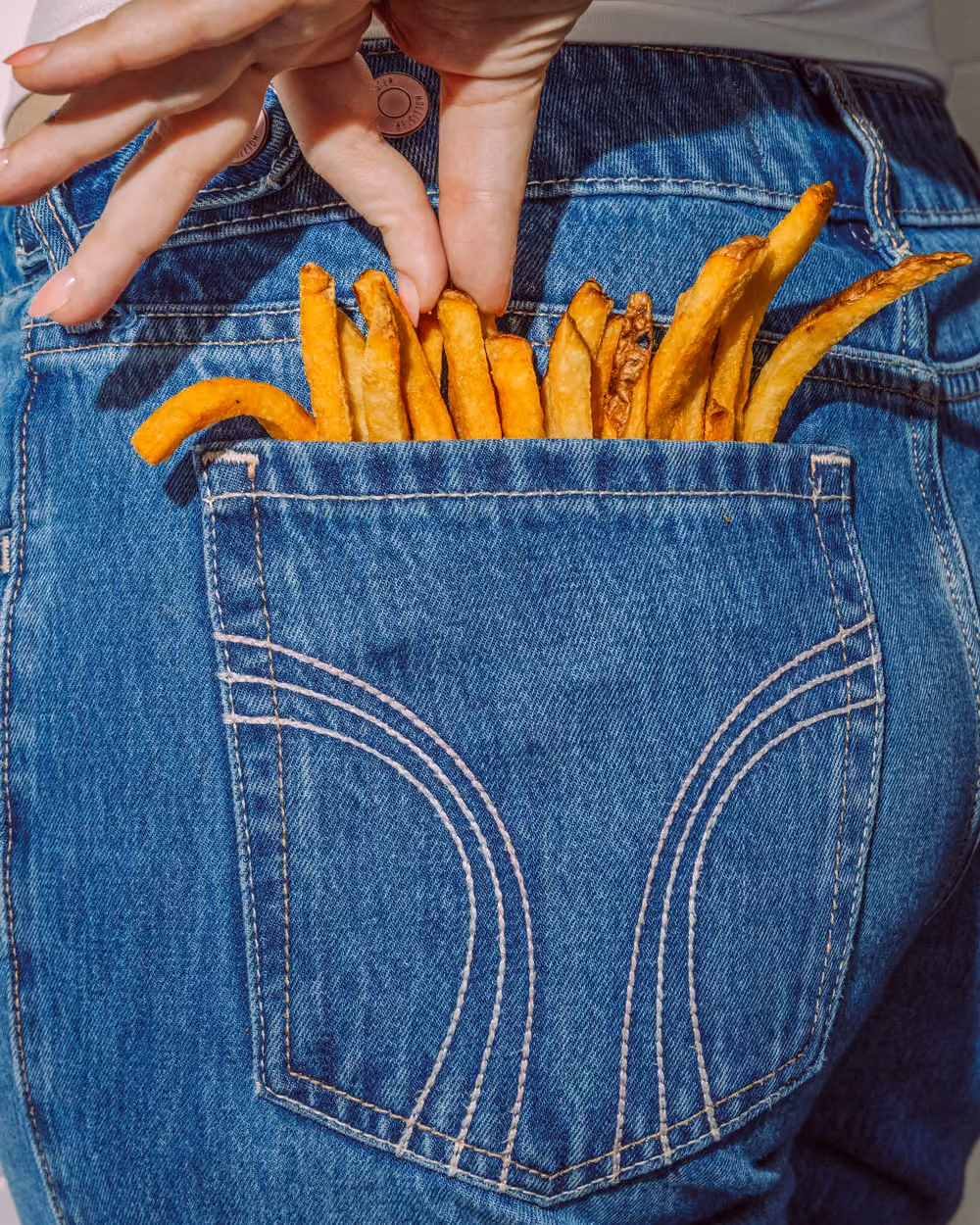 French fries in a back jean pocket