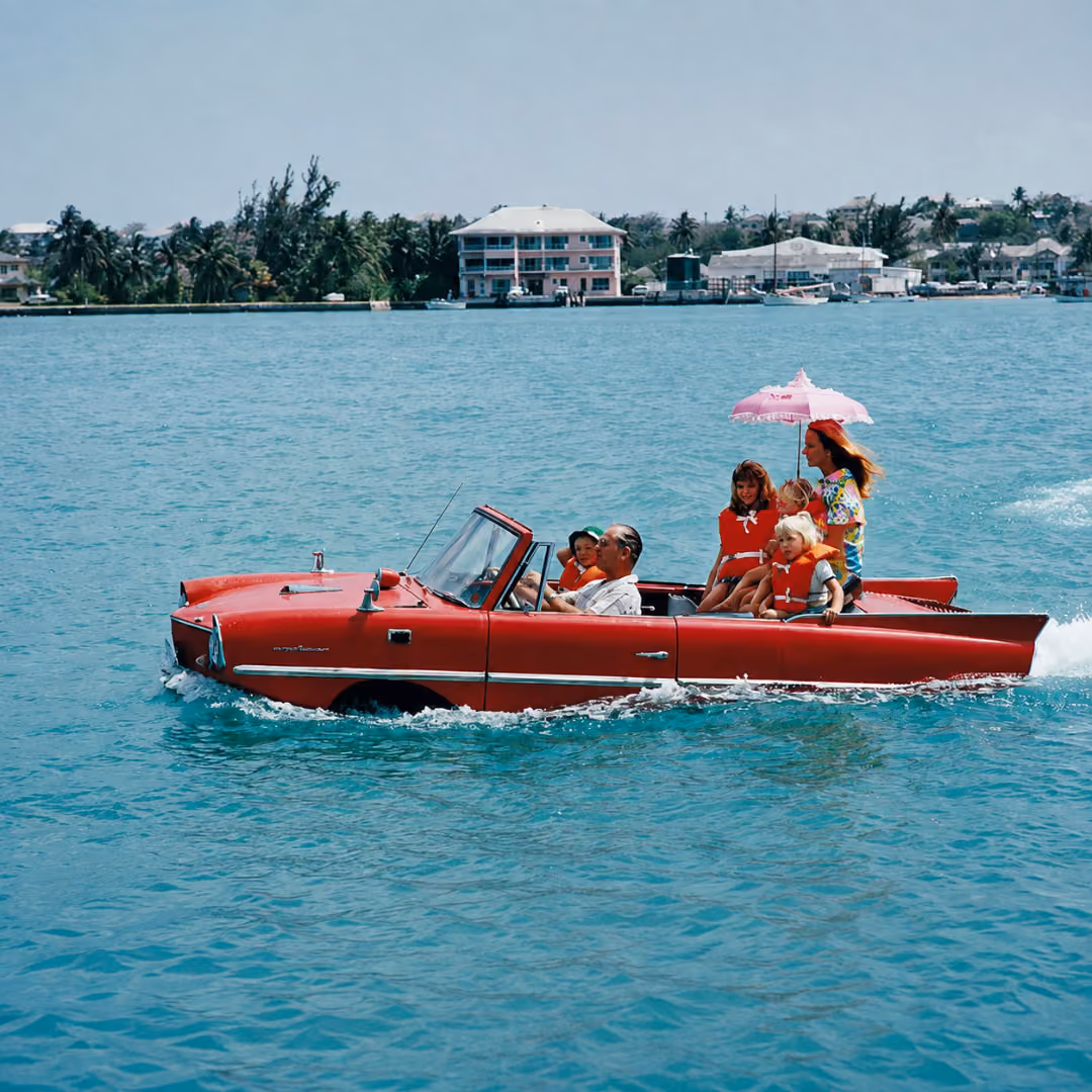Vintage picture of family in a convertible boat in the sea