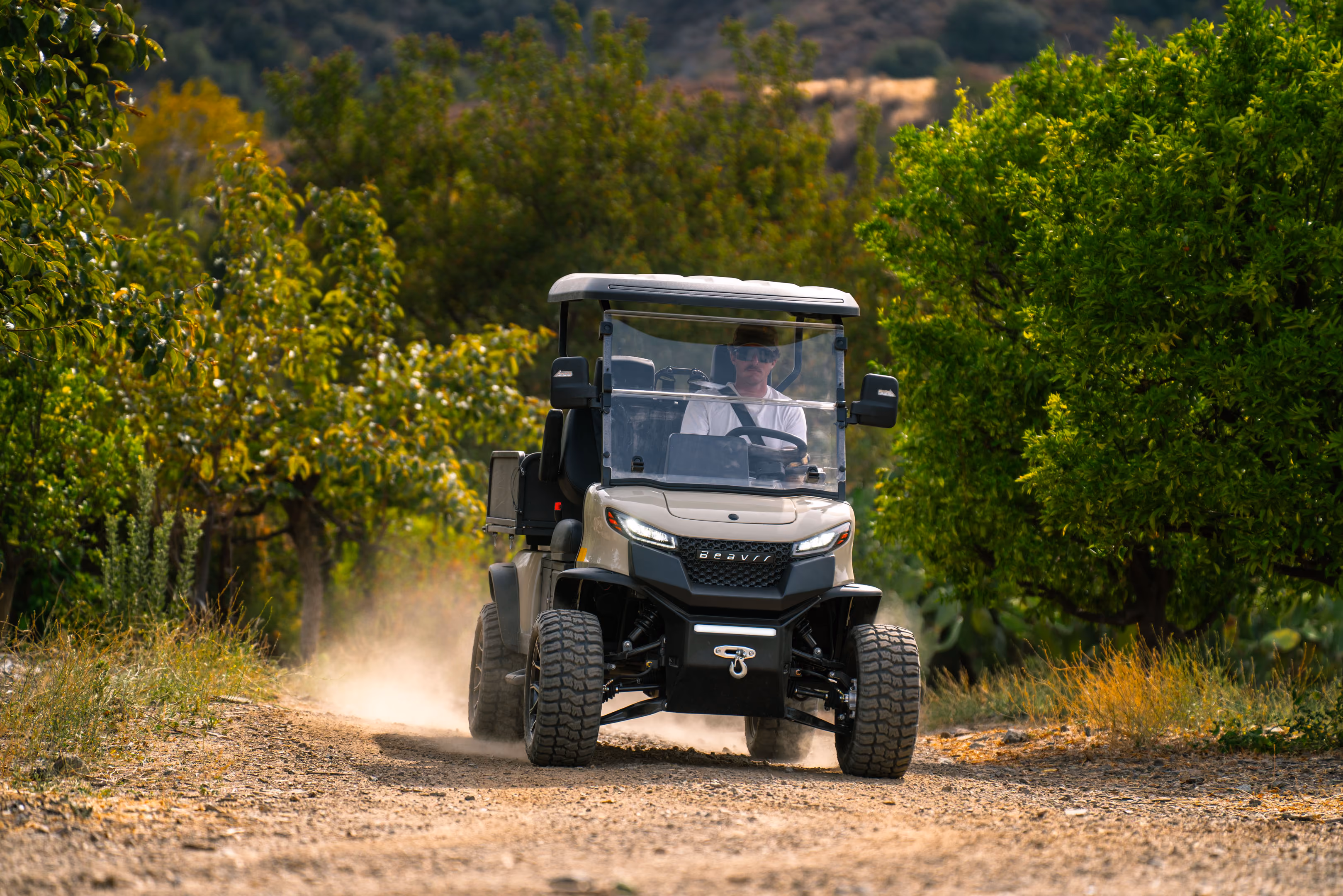 Grounds crew operating equipment on a maintained property