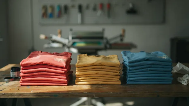 Folded custom t-shirts in bright colors at the print shop