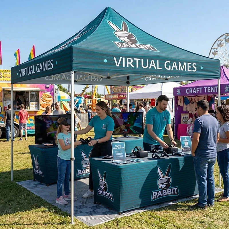 Outdoor tent booth with Rabbit Virtual Games branding offering VR headset demos to families.