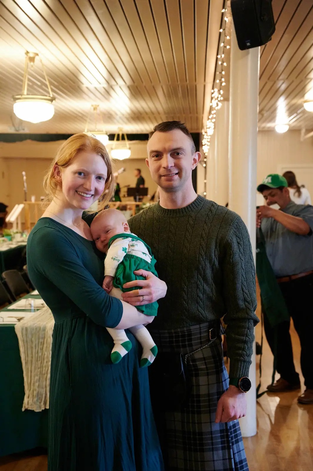 Parents with their baby at a St. Patrick's gathering