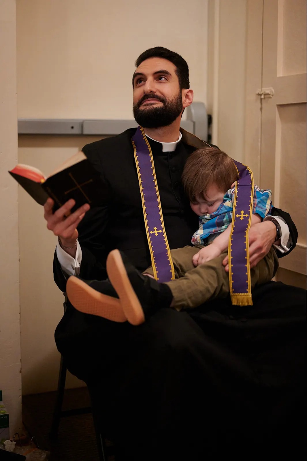 A little one up close with the priest's stole after Mass