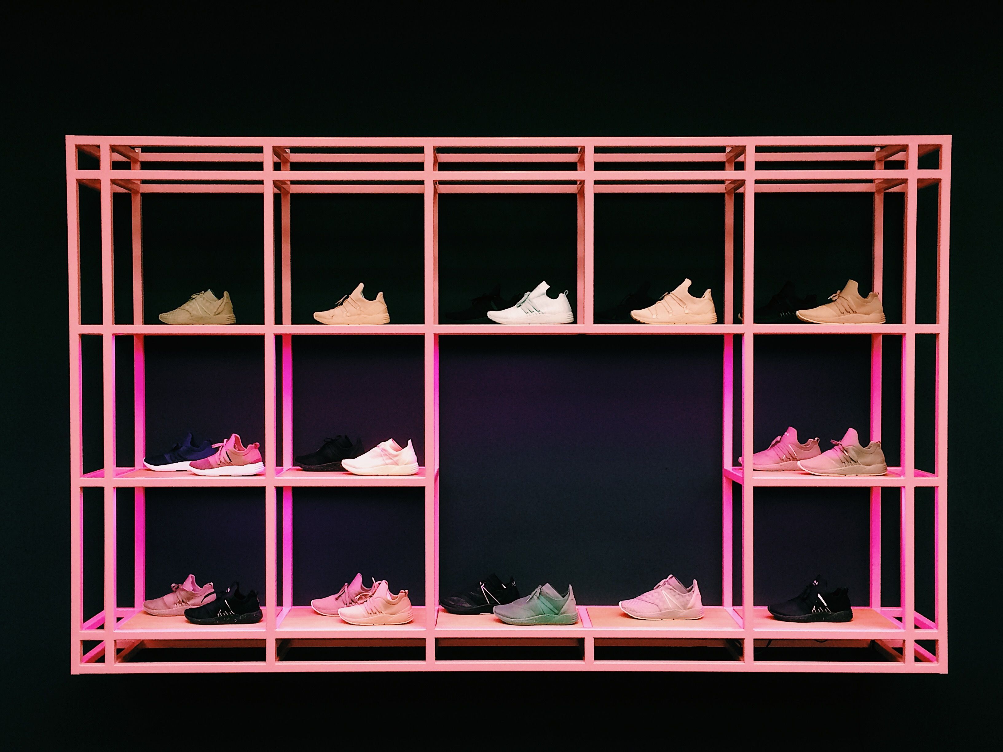 Sneakers displayed on shelves for an everyday shoe insole guide