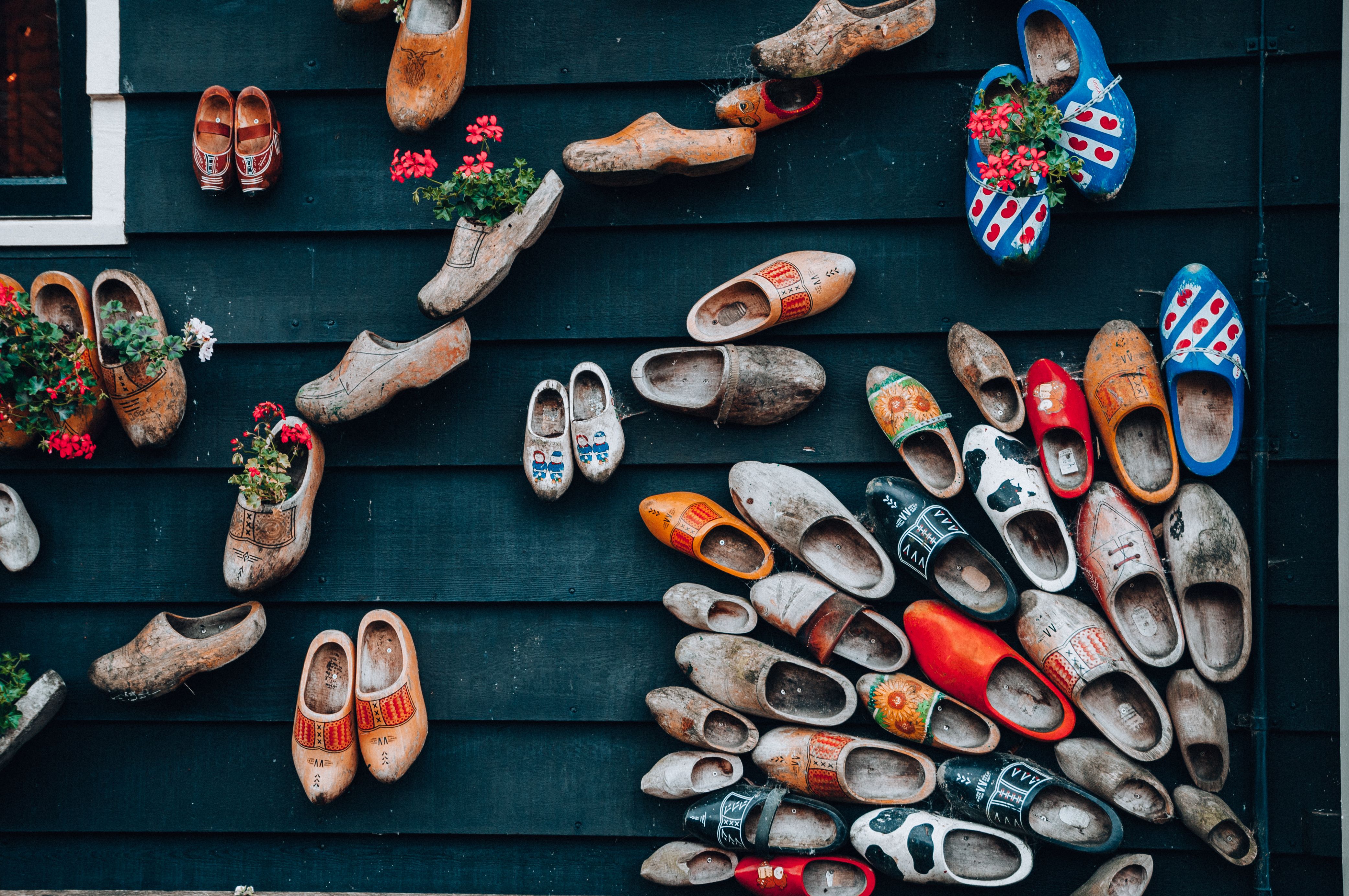Supportive clogs and house shoes displayed for a plantar fasciitis guide