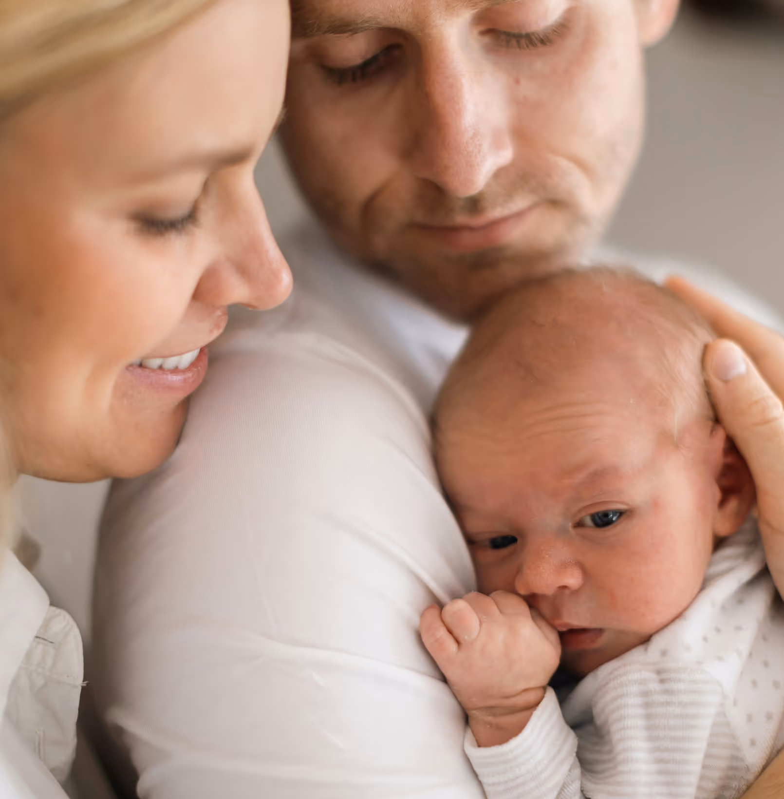 A family gathered around their newborn.