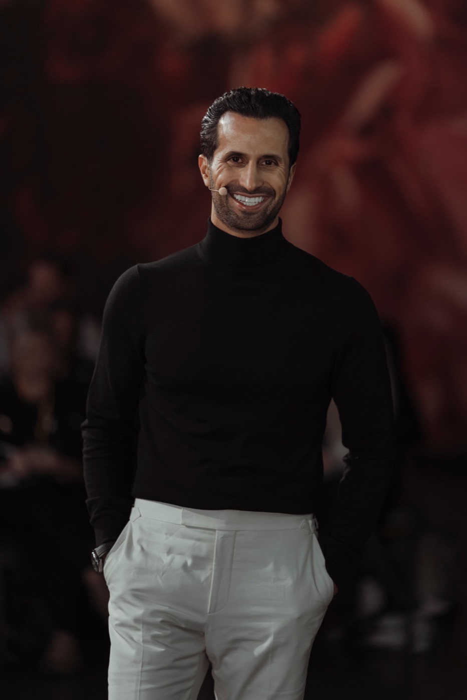 David Ghiyam standing before a seated audience