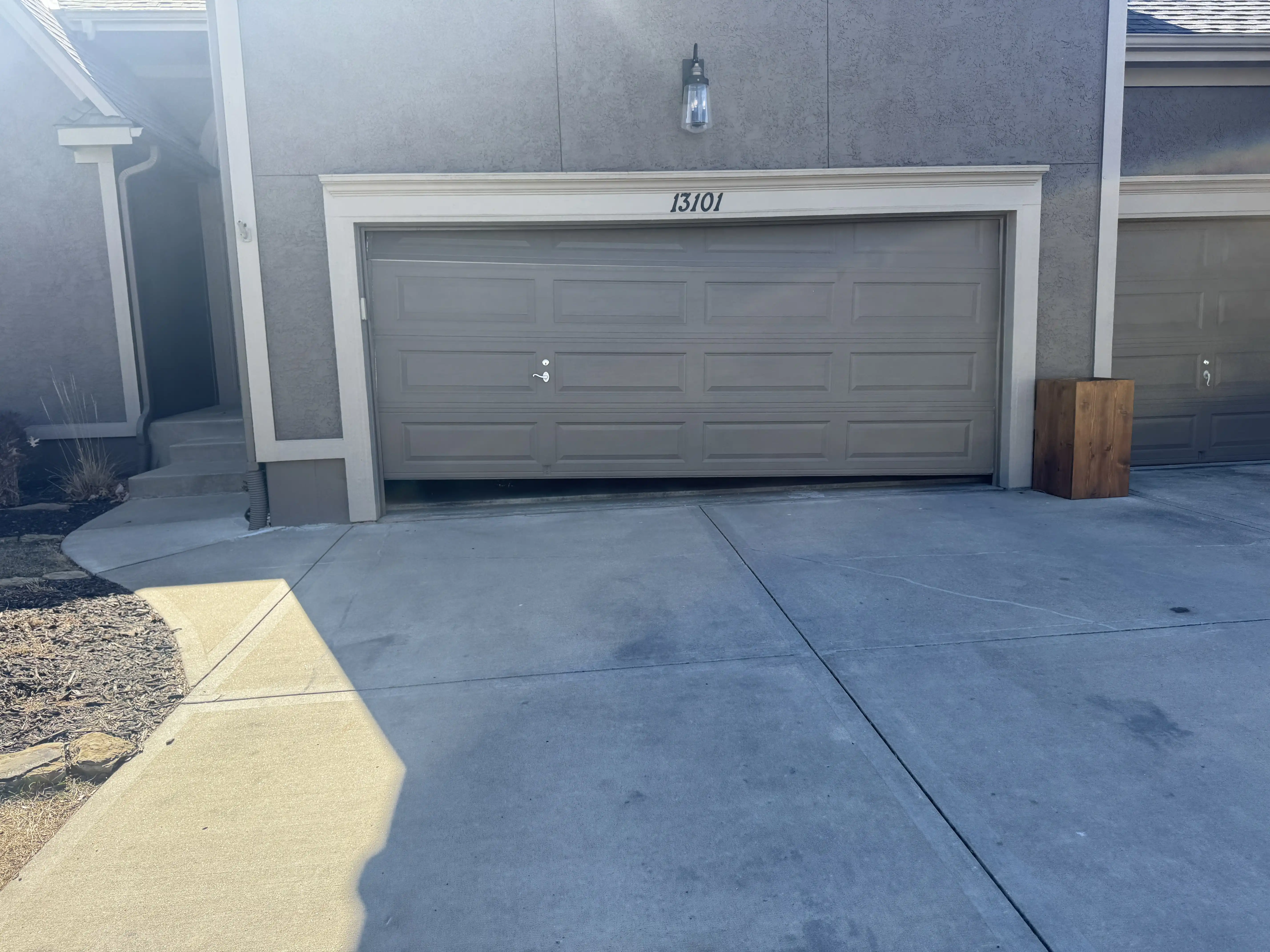 Snapped garage door torsion cable in Olathe, KS before replacement