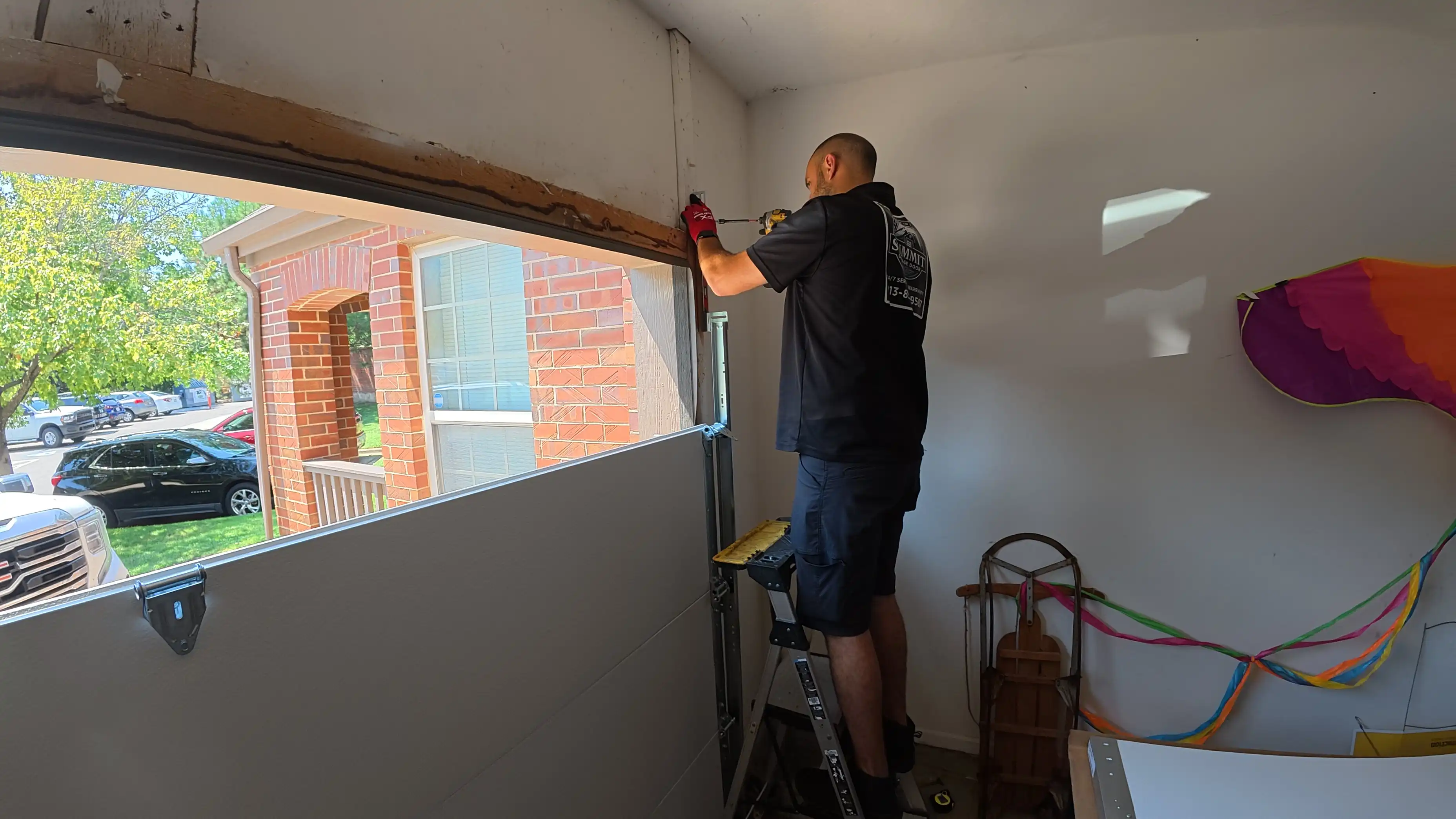 New garage door installation in progress — sections and track going up