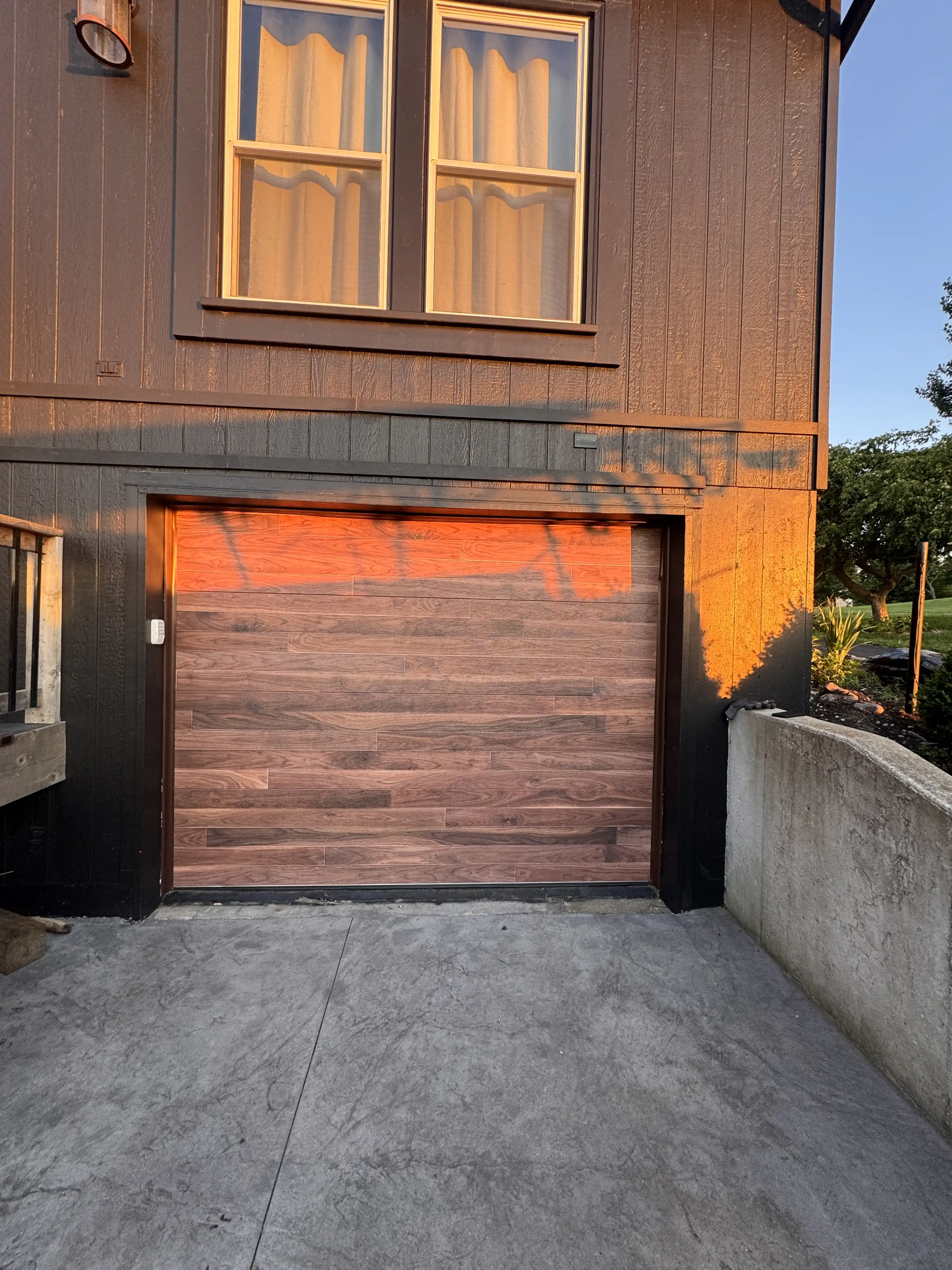 New garage door installation in progress — sections and track going up