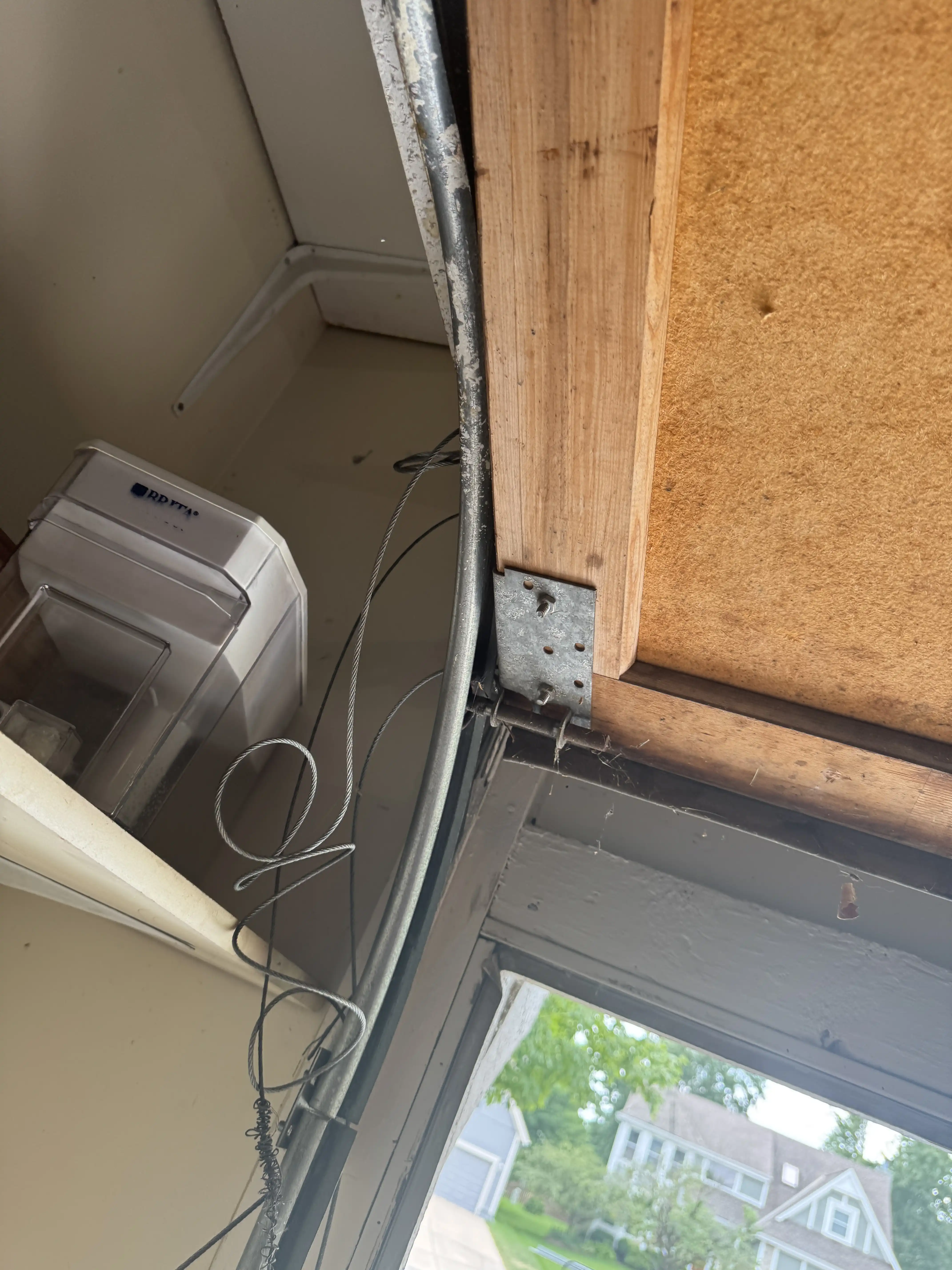 Repaired garage door hardware after a service call in Overland Park, KS
