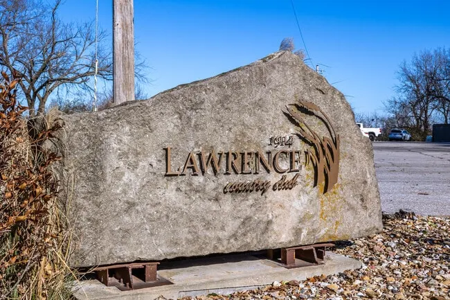 Carved limestone boulder sign for Lawrence Country Club, established 1914