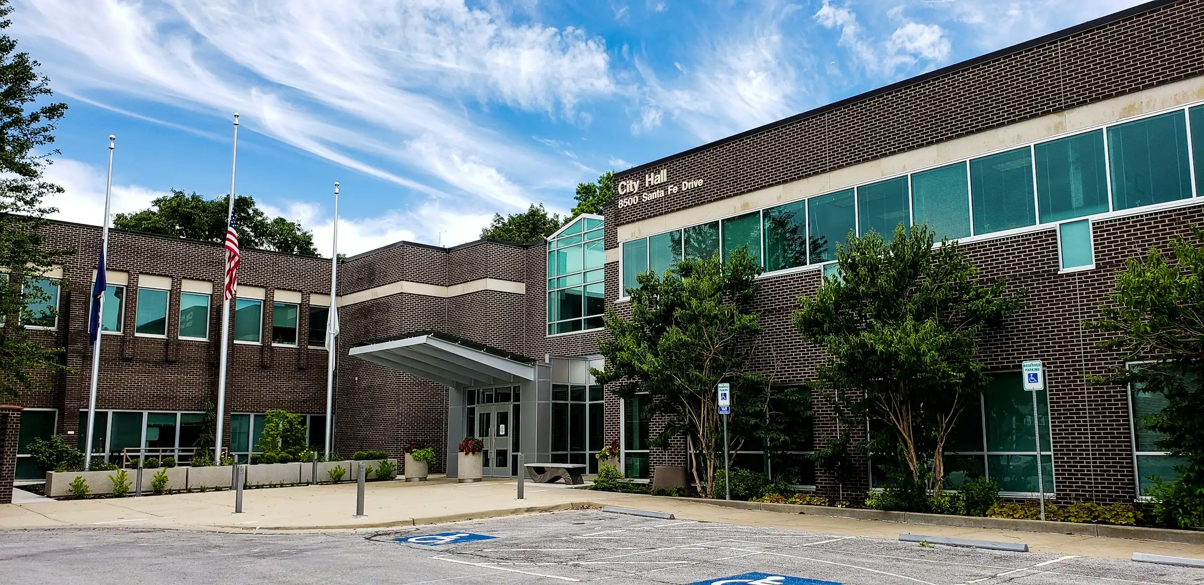 Overland Park City Hall on Santa Fe Drive, brick facade with flags flying out front