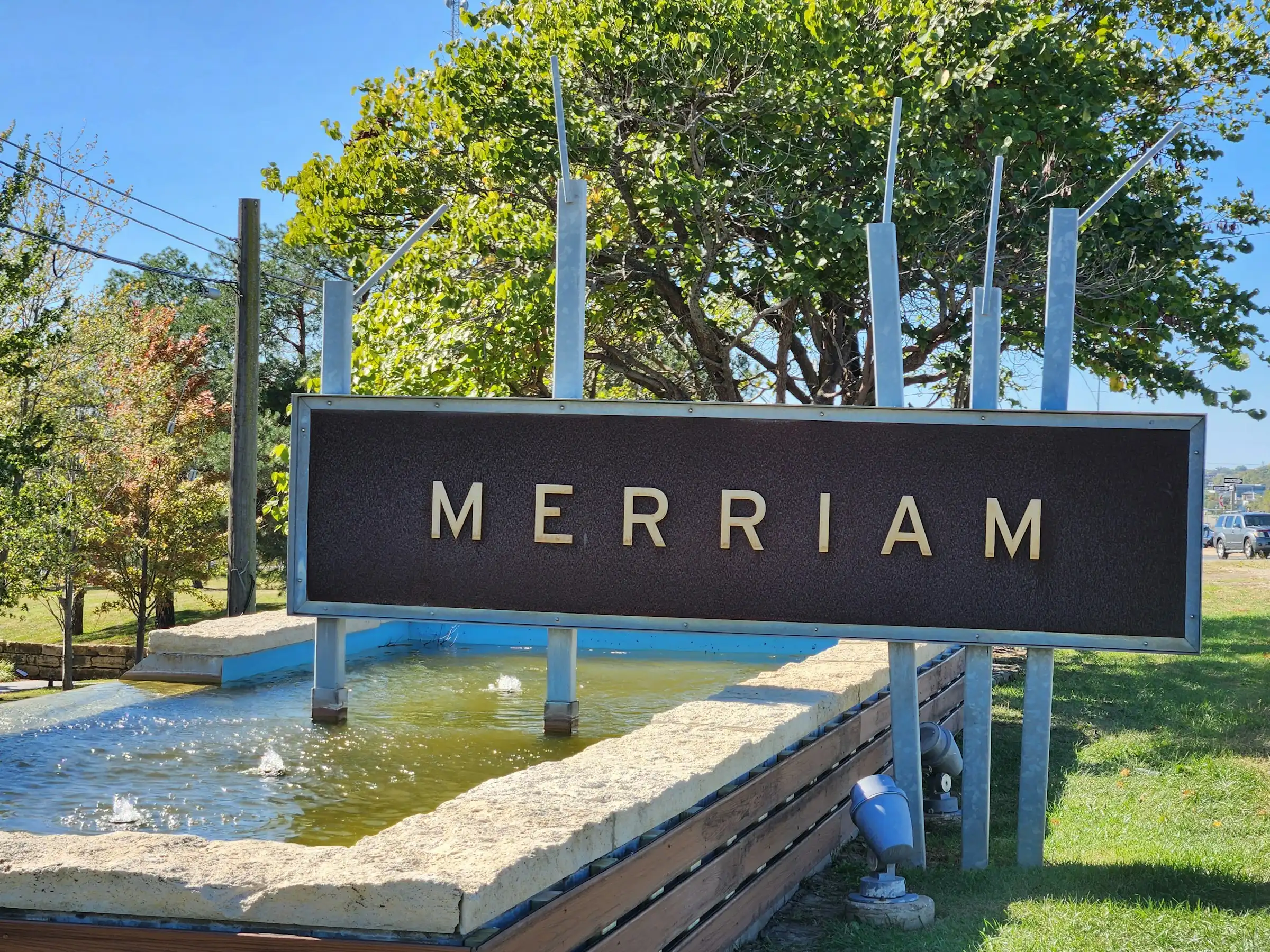 Merriam city monument sign standing over a shallow fountain pool